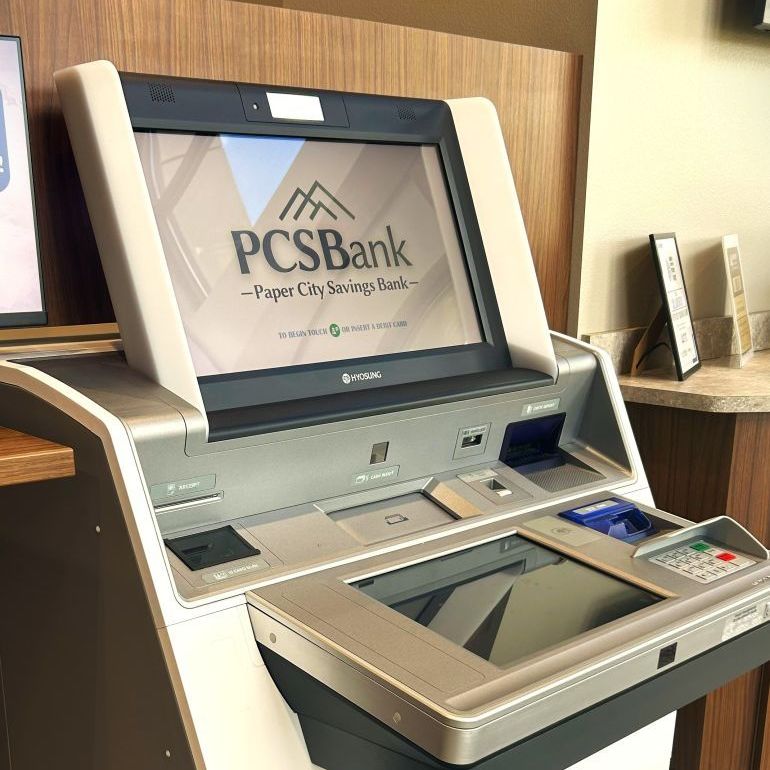 person holding phone and credit card