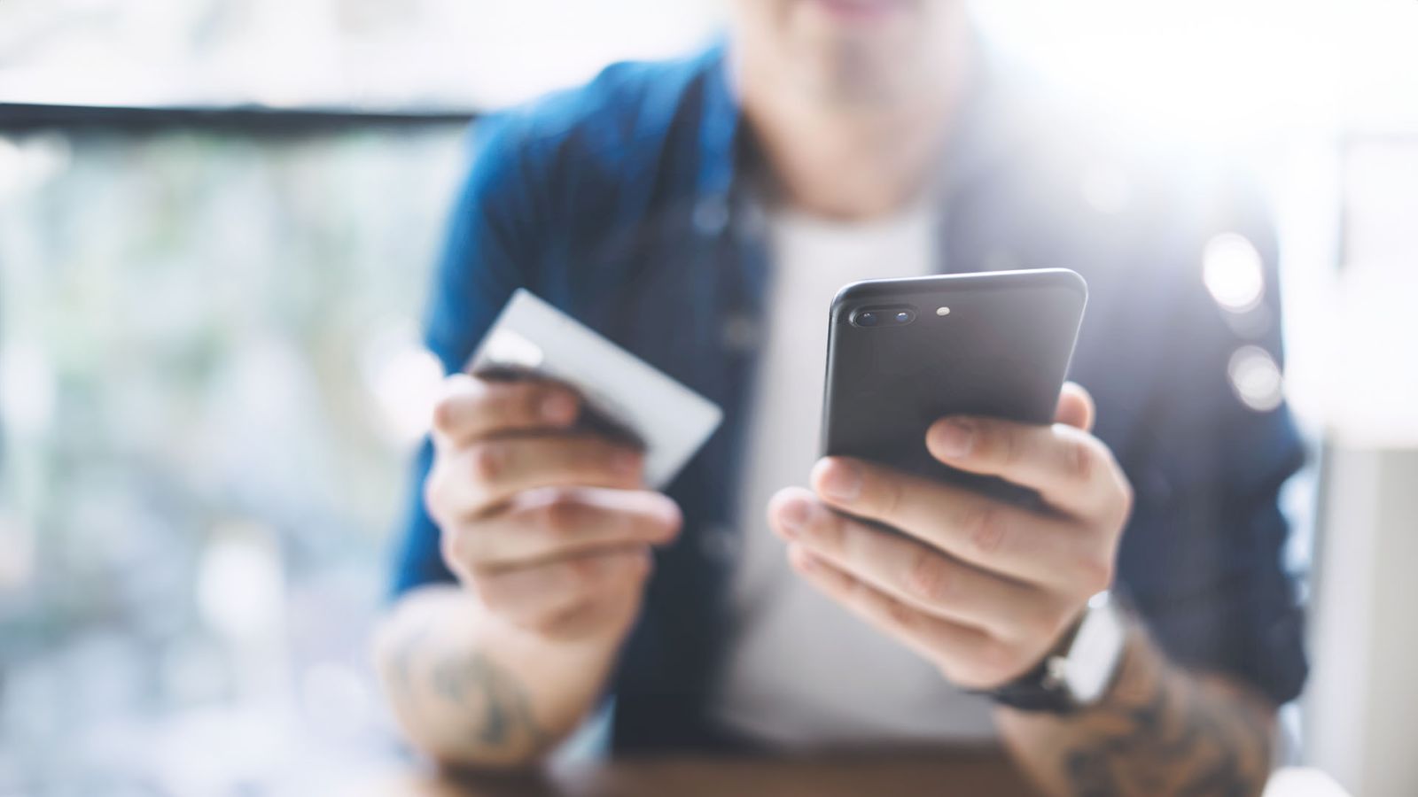 person holding a debit card